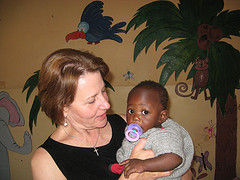 Peggy in Africa with orphan baby
